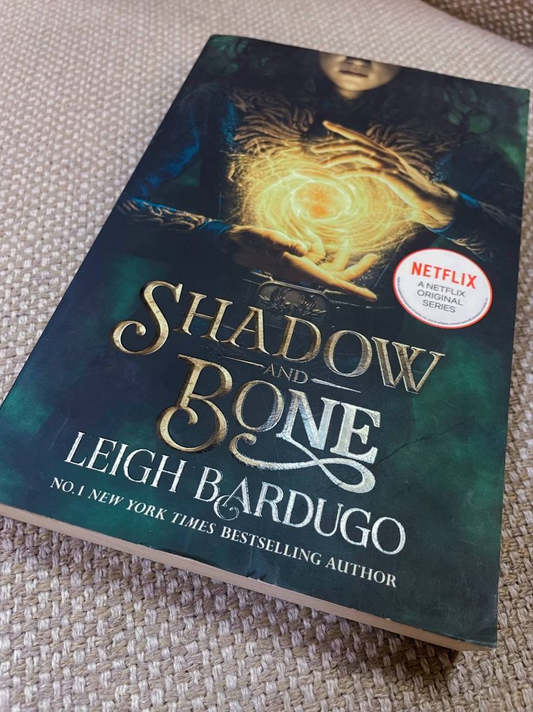 Shadow and bone book on the table
